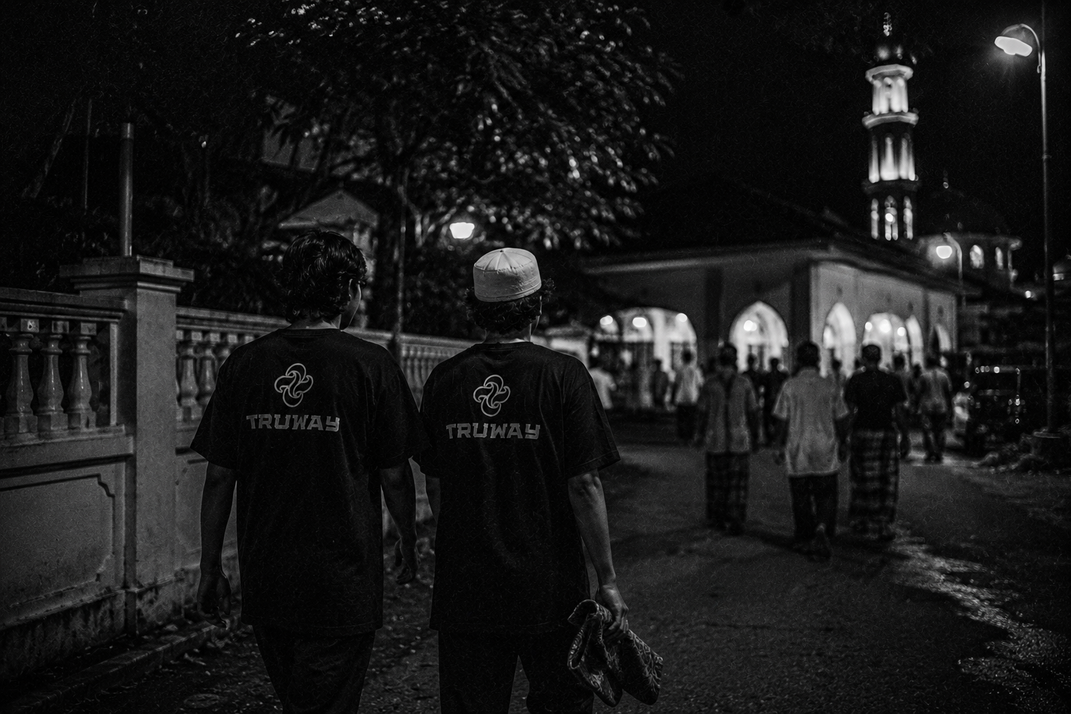 Two TRUWAY friends walking toward a mosque at night